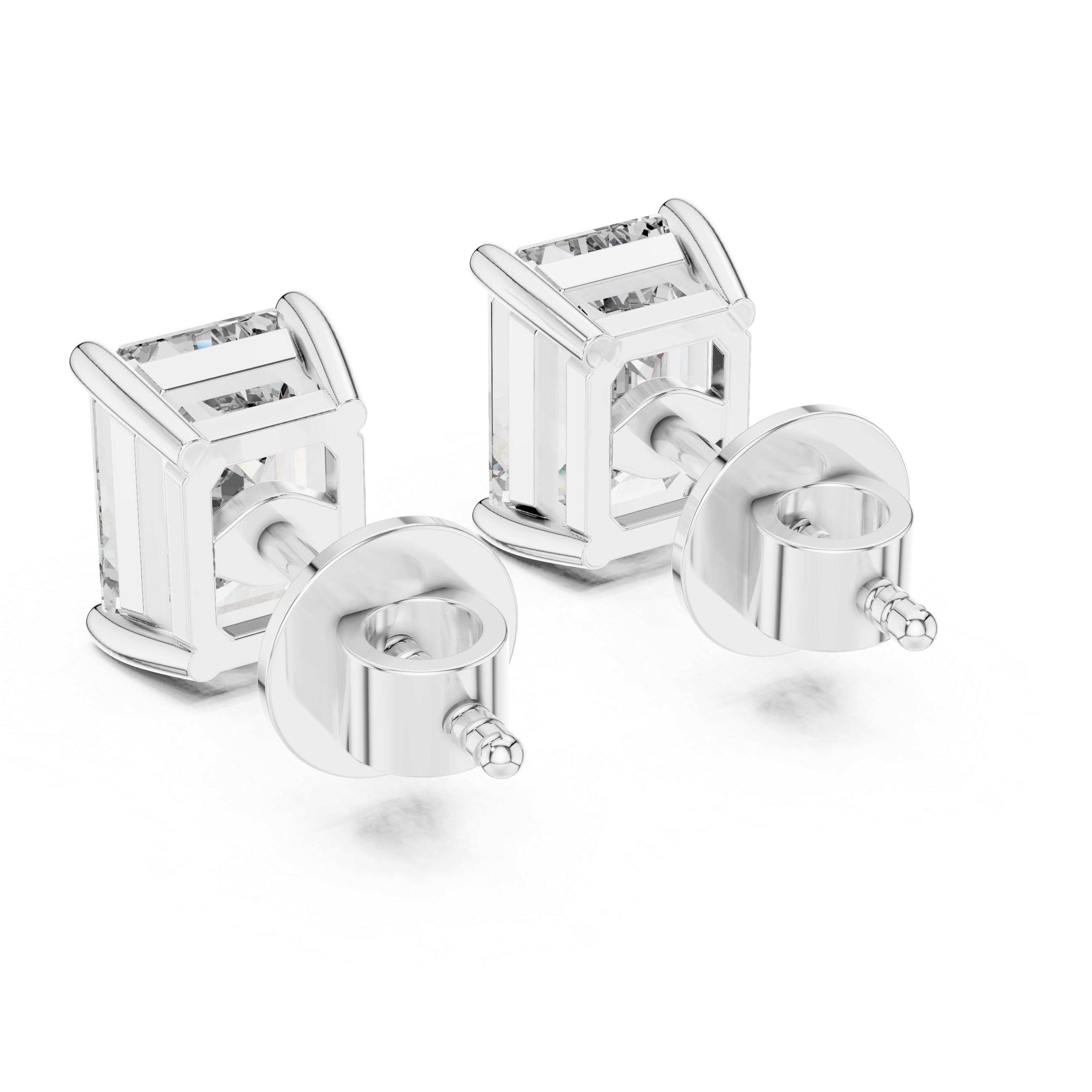 Pair of silver stud earrings on a white background