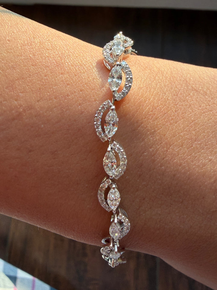 Diamond bracelet on a wrist with a blurred background