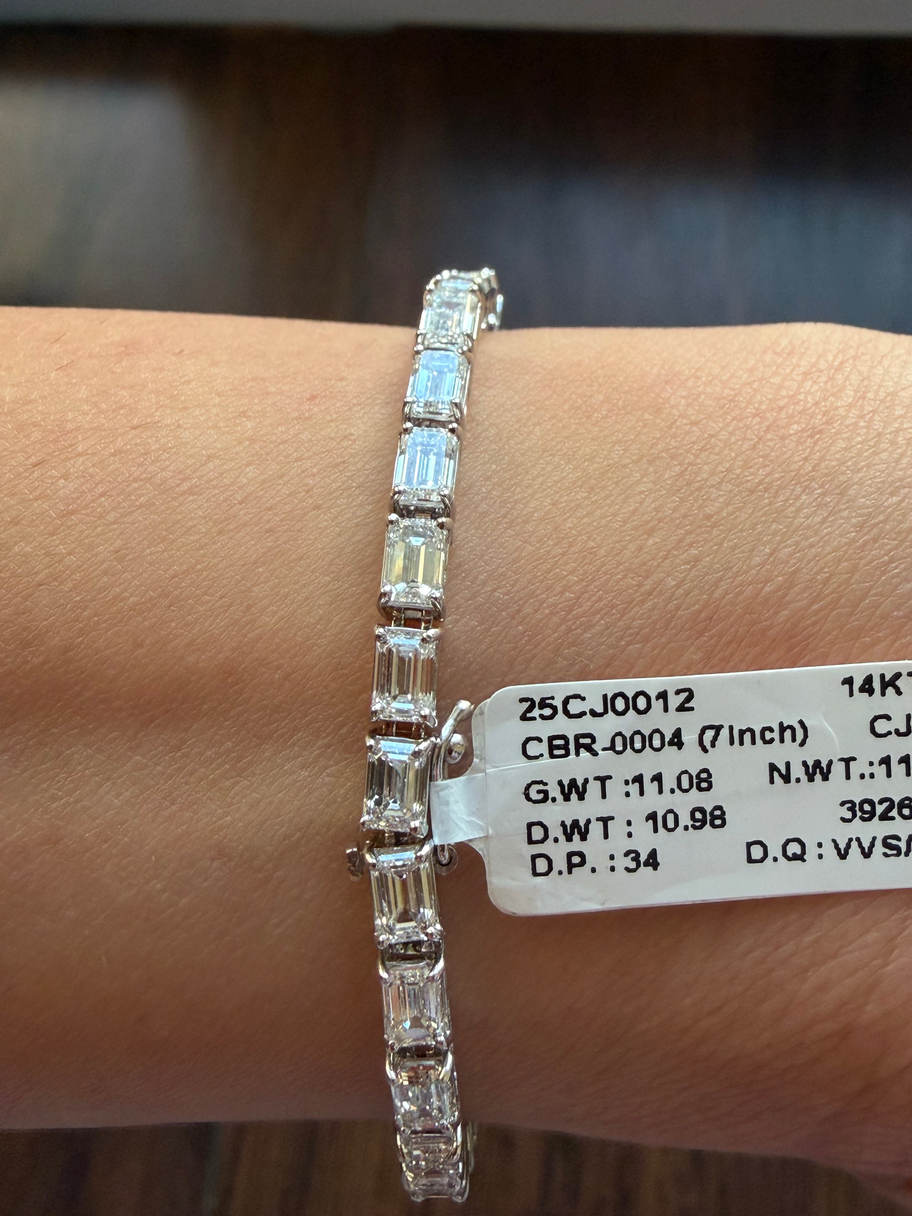 Diamond bracelet on a wrist with a label displaying jewelry details.