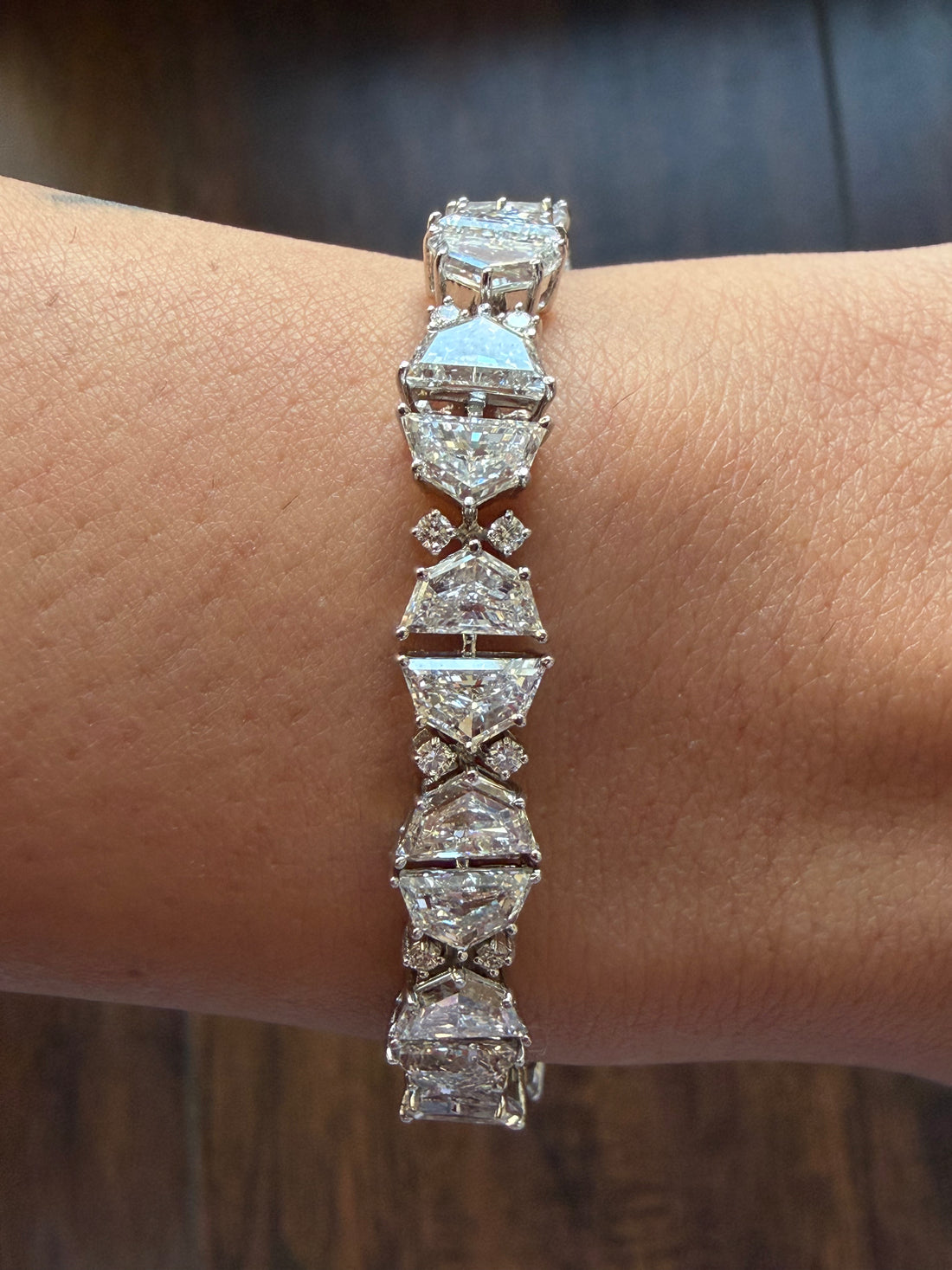 Diamond bracelet on a wrist with a blurred background