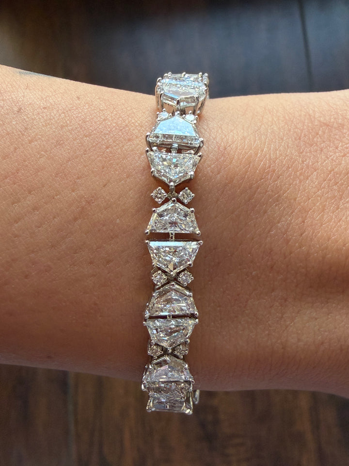 Diamond bracelet on a wrist with a blurred background