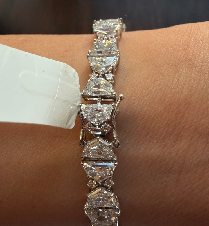 Diamond bracelet on a wrist with a blurred background