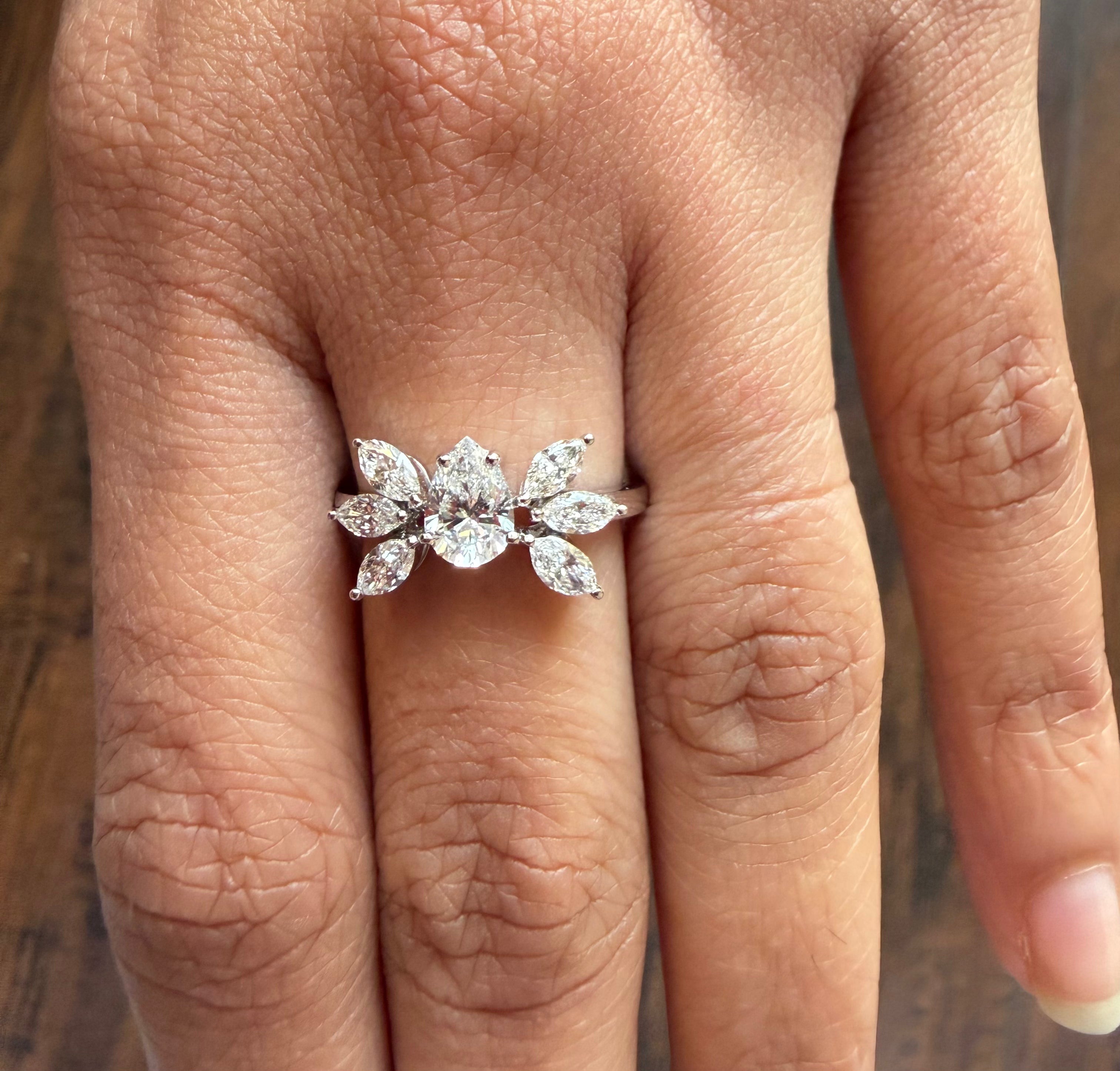 Diamond ring on a finger with a blurred background