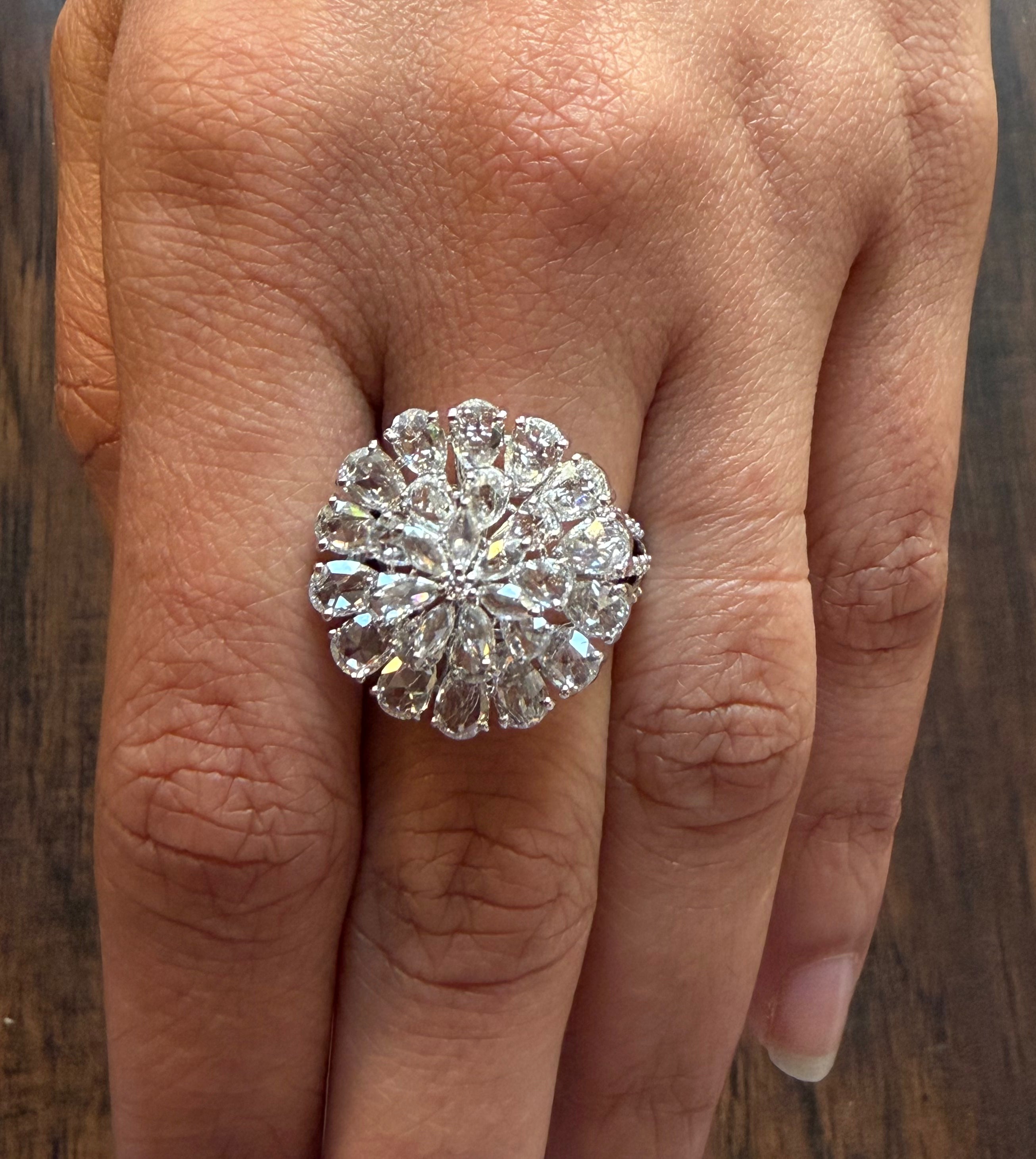 Diamond ring on a finger with a wooden background