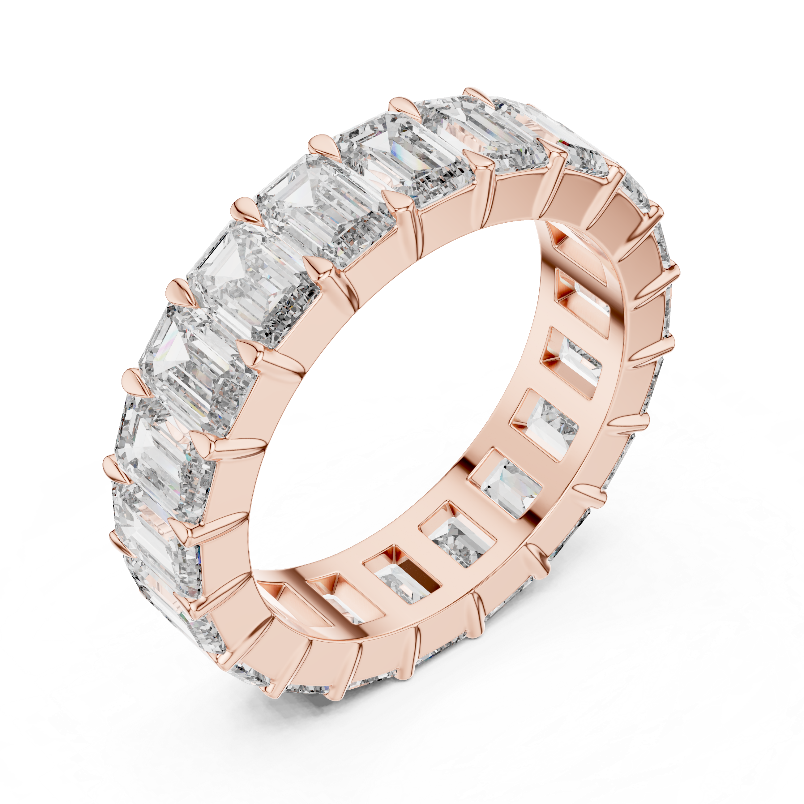 Rose gold ring with emerald-cut diamonds on a white background