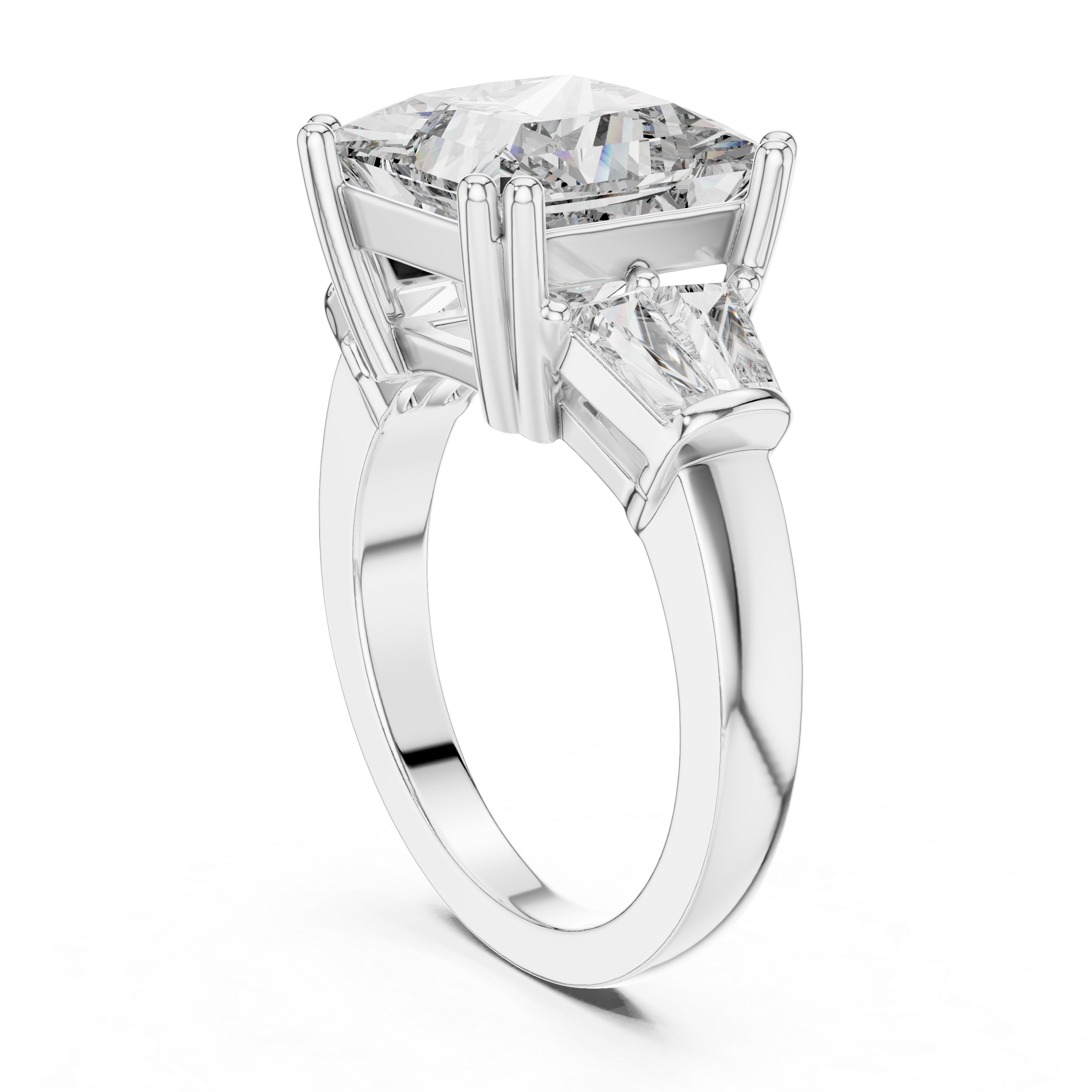 Diamond ring with a central pear-shaped diamond and two smaller round diamonds on a white background