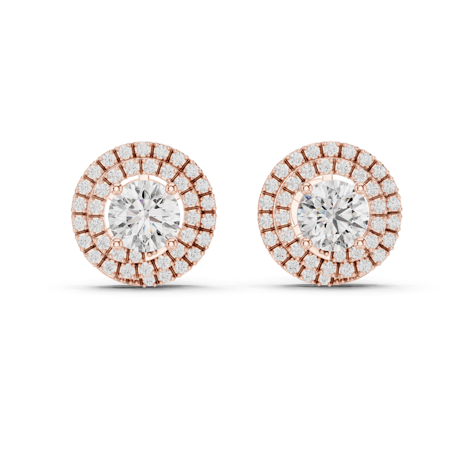 Pair of diamond earrings with rose gold and white gold setting on a white background