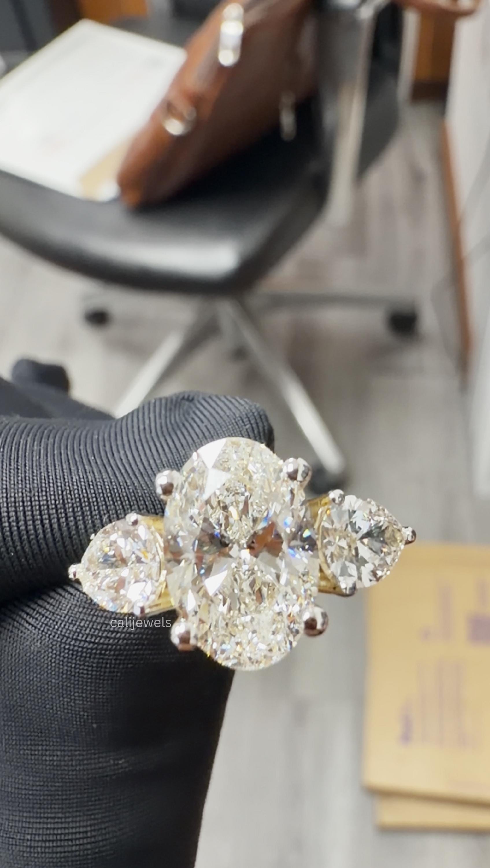 Oval Cut Lab Grown Diamond Three Stone Engagement Ring