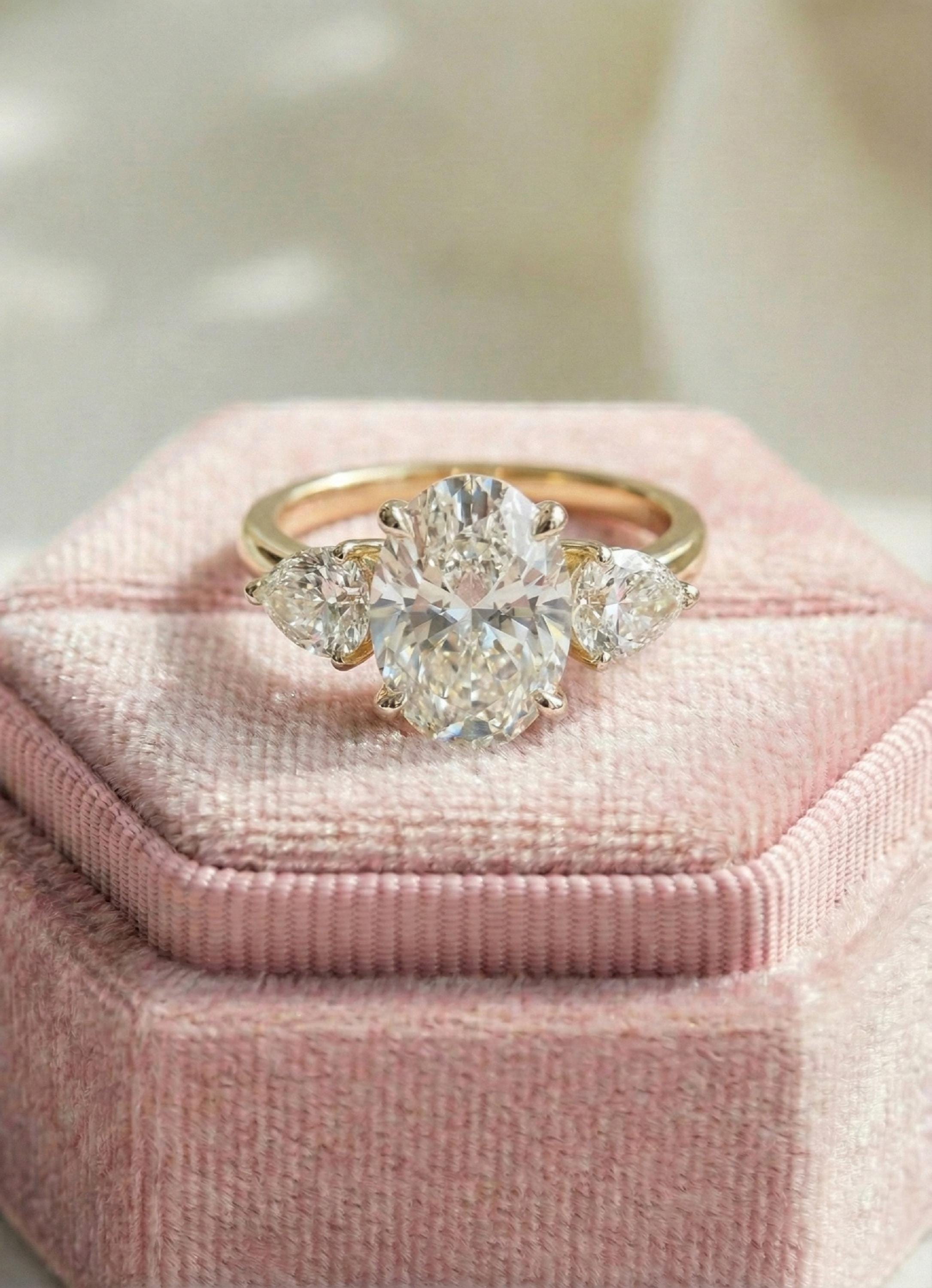 Oval Cut Lab Grown Diamond Three Stone Engagement Ring