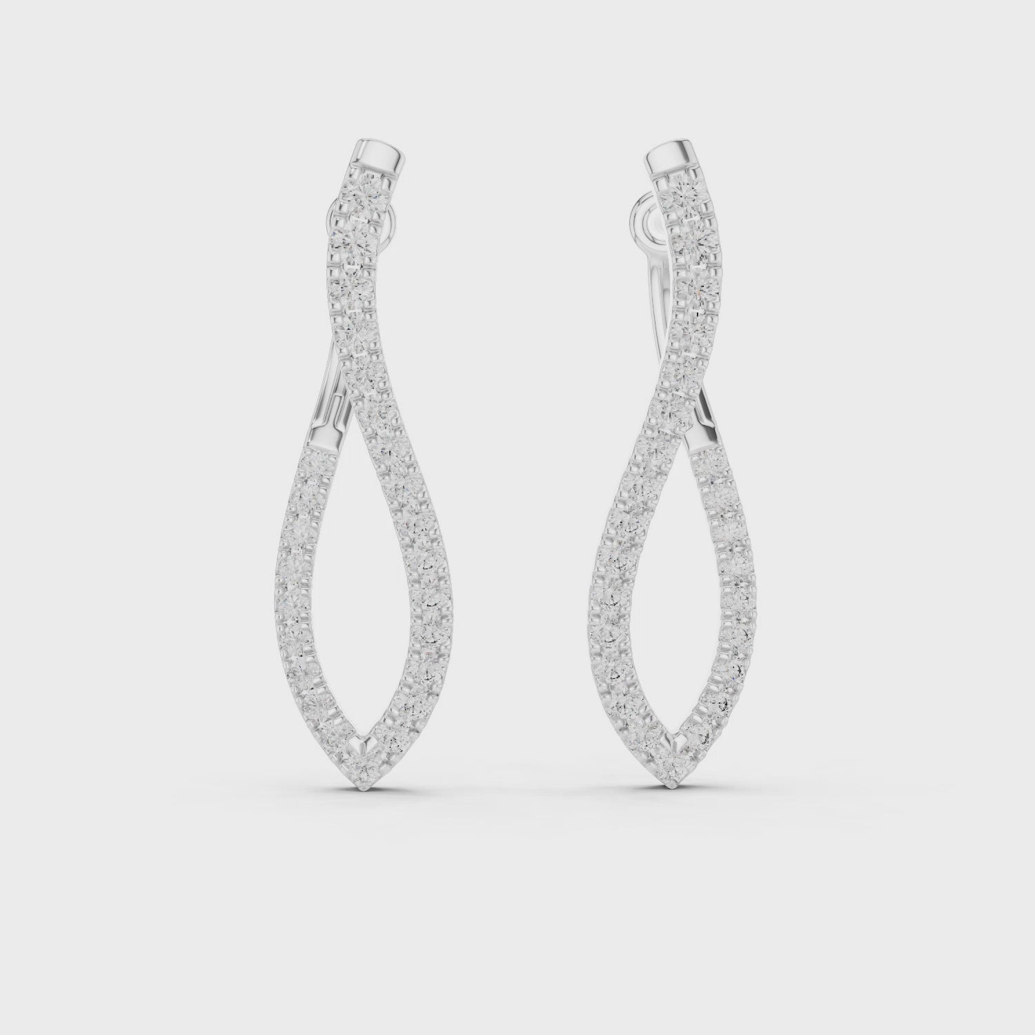 “Twist Hoop Diamond Earrings in 14Kt White Gold”