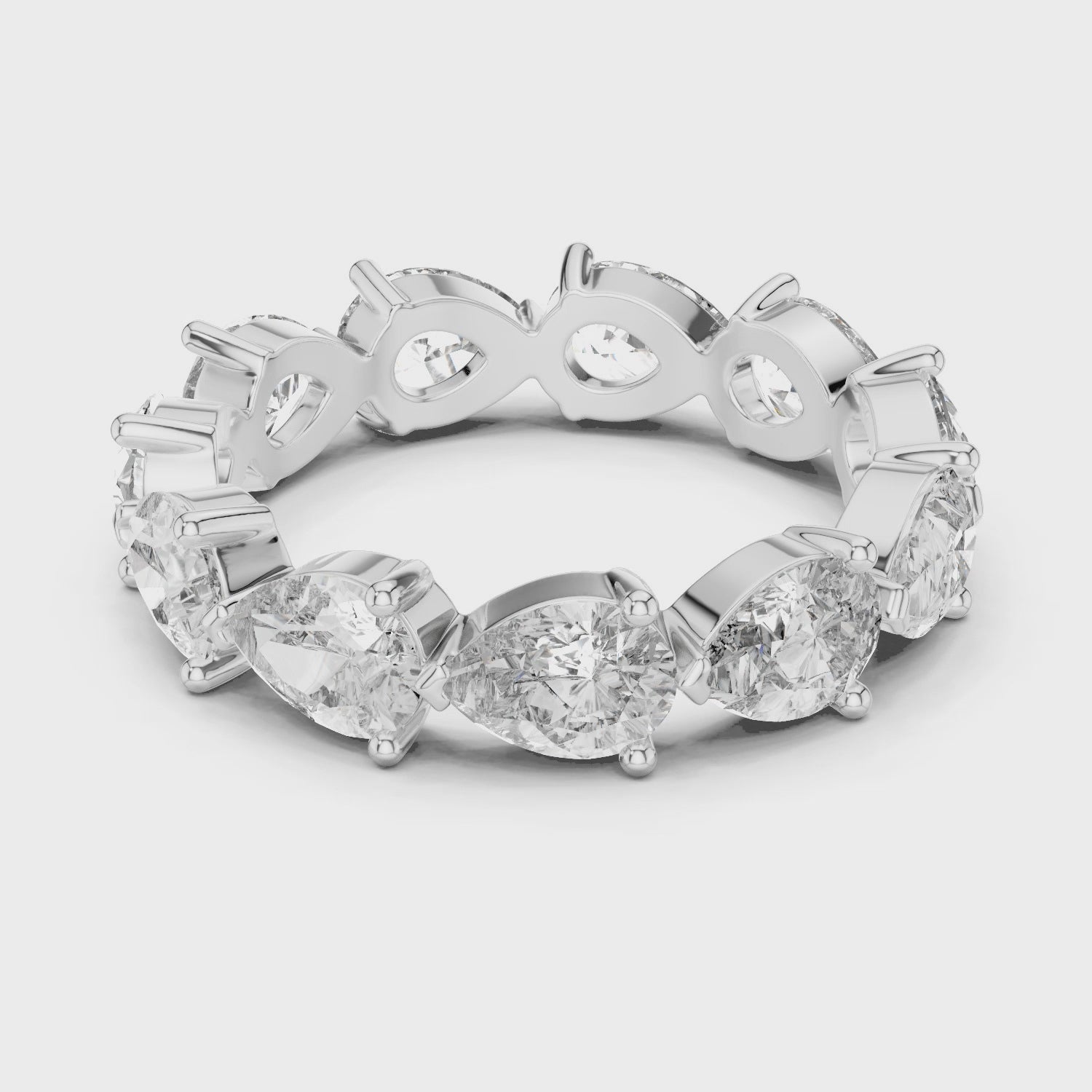 “Elegant Pear-Shaped Full Eternity Ring – White Gold”